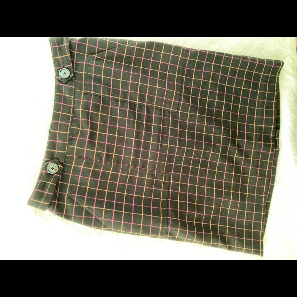 Knee length skirt with back zipper.